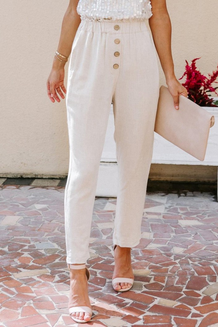 Hlače marelične barve in širokimi žepi Eberta